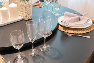 Restaurant table with wine glasses and napkins