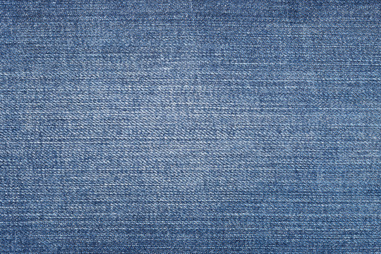 Close up shot of blue worn denim jeans fabric
