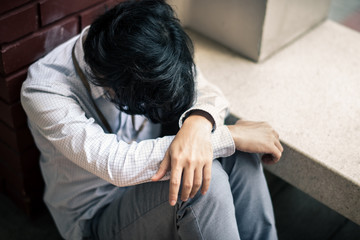 business man is stressed from his work. depression and anxiety concept.