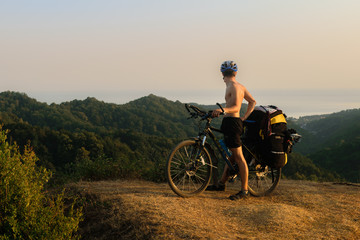 Obraz premium Bicyclist in mountains in Abkhazia
