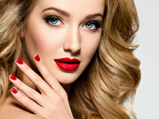 Pretty woman with long  hair and red nails