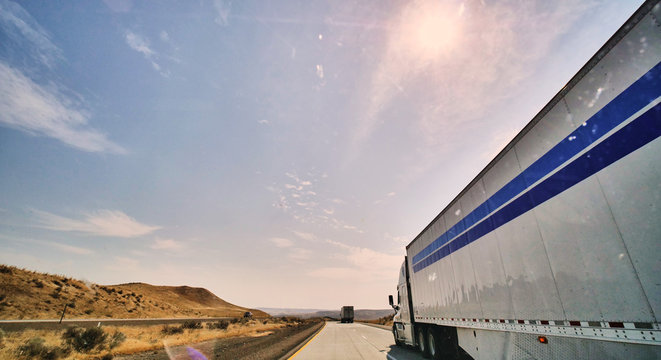 freight truck on open highway in desert