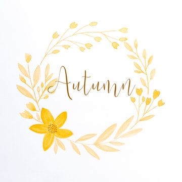 Autumn word and drawing autumn flowers wreath in watercolor style on white paper background, greeting card, banner