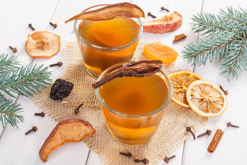 Green spruce branches and traditional compote of dried fruits for Christmas