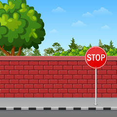 Brick wall with stop sign on the pavement - 177704165