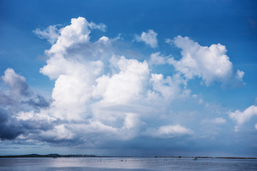 Naklejka na ściany i meble Cloud and blue sky over the sea