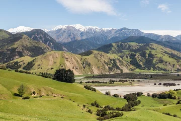 Schilderijen op glas grassy hills above Clarence river valley in springtime, South Island, New Zealand  © Patrik Stedrak