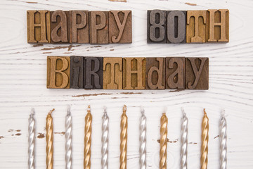 Happy 80th Birthday Spelled in Type Set