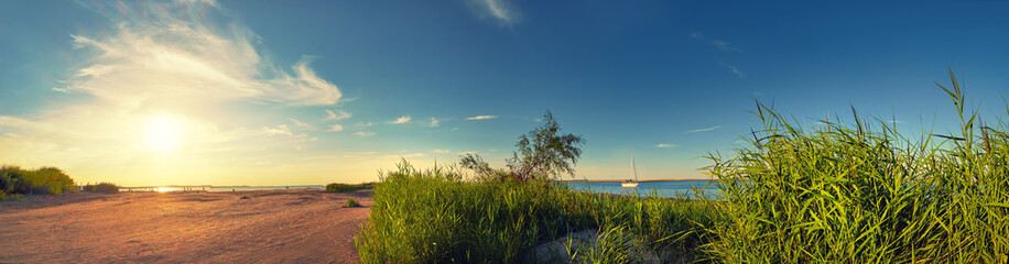 Fototapeta na wymiar Panoramic image of a seaside by lighthouse in Swinoujscie, Poland