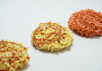 Rice cracker,Thai dessert, on white background. Pink color rice cracker made from herbal coloring.