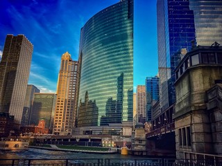 Colorful buildings along Chicago Riverwalk during autumn evening.