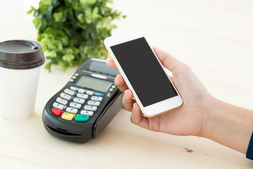 Hands holding smart phone pay shopping concept.