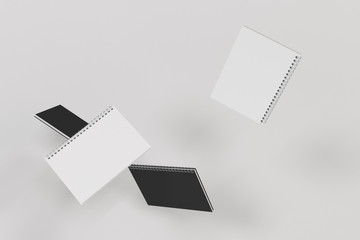 Four notebooks with spiral bound on white background