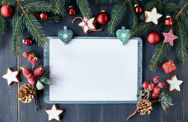 Christmas background in white and red on dark wood, copy space