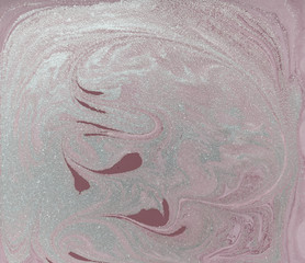 Liquid gold marbled pattern. Pale pink background