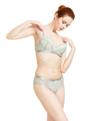 Obraz premium Attractive slim woman in grey matching underwear