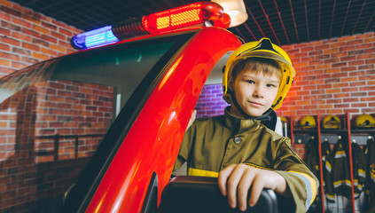 Fototapeta premium Child Firefighter play