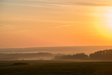 Beautiful view of misty sunrise in valley