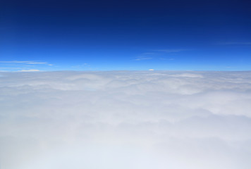 Naklejka na ściany i meble Puffy clouds view from aeroplane window.