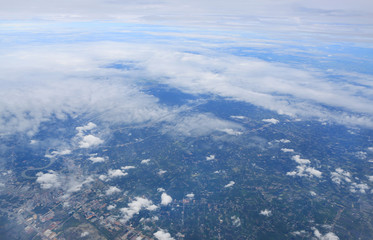 Fototapeta na wymiar Skyline View above the Clouds from air plane. Bird's-eye view.