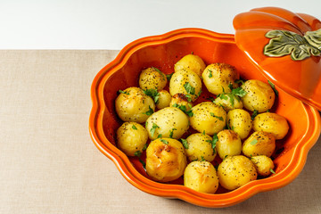 Oven-roasted potatoes with spice on a table , top view. Cooking concept.