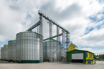 Fototapeta na wymiar Modern large granary. Large metal silos.