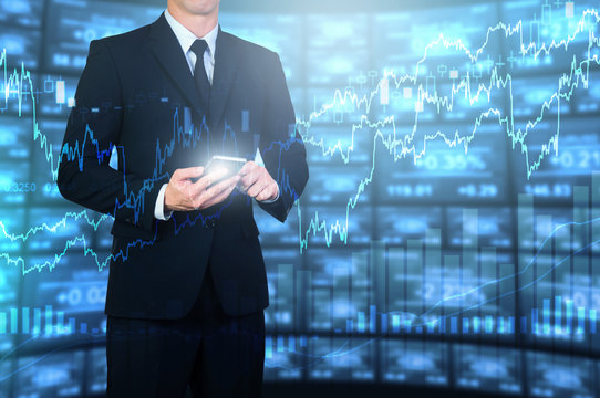 businessman using smart phone with digital electronic investing screen