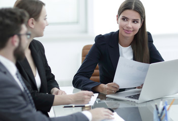 business partners discussing documents and ideas at meeting