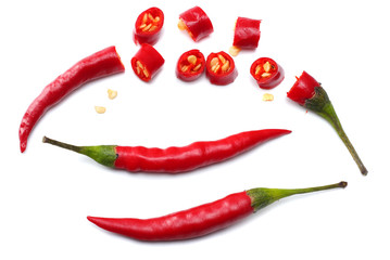 sliced red hot chili peppers isolated on white background top view