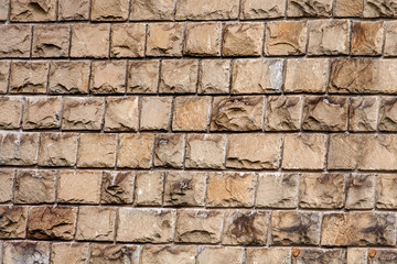 old wall lined with a stone of brown color