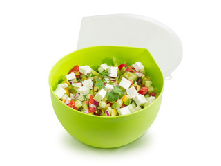Greek salad in round green food container