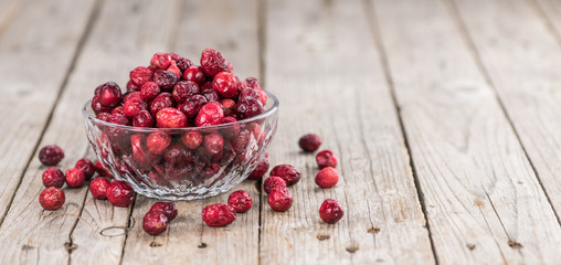 Some fresh Dried Cranberries (selective focus; close-up shot)