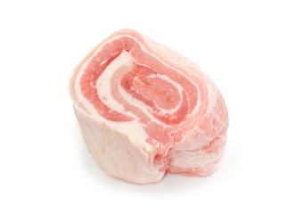 Uncooked streaky pork belly on a white background