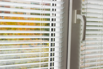 White Venetian blinds on a modern plastic window