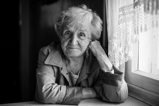 Portrait of an elderly woman, monochrome photo.