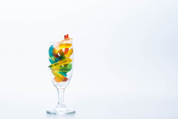 Colorful Jelly Worms Snakes isolated in wine glass isolated for Halloween decoration
