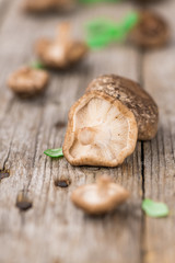 Wooden table with Shiitake mushrooms, selective focus