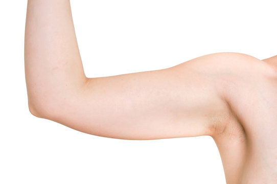 Woman is testing her muscle under her arm