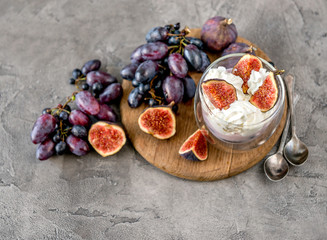 An useful dessert - yogurt, muesli and figs with grapes