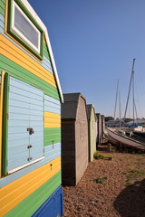 A row of colorful wooden Huts along the seafront in Whitstable, UK