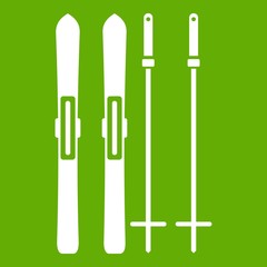 Skis and ski poles icon green