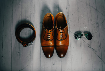 Groom leather shoes with wedding rings