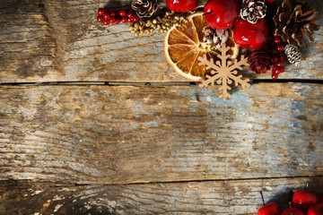 Christmas background with holiday decoration on old wood texture. Top view with copy space 