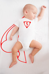 sleeping baby, in dreams superman