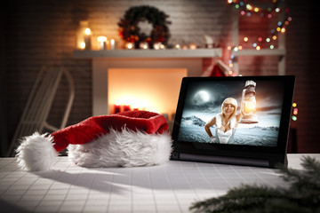 Obraz premium Ice queen and tablet in xmas interior 