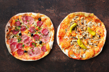 Homemade pizza. Top view with copy space on dark stone table