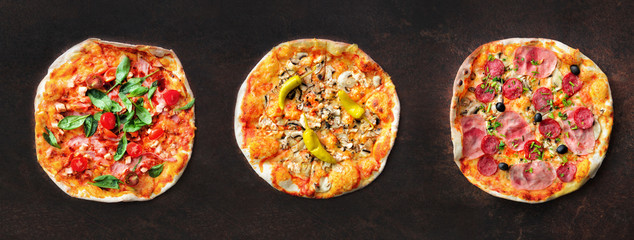 Fototapeta na wymiar Pizza pattern. Three pieces set on dark background. Top view, copyspace