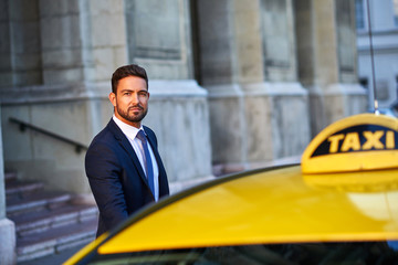 Young businessman with a taxi	