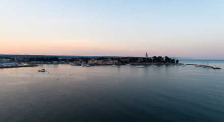 aerial drone view of sunrise over novigrad