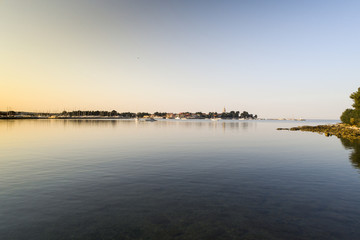 aerial drone view of sunrise over novigrad in summer
